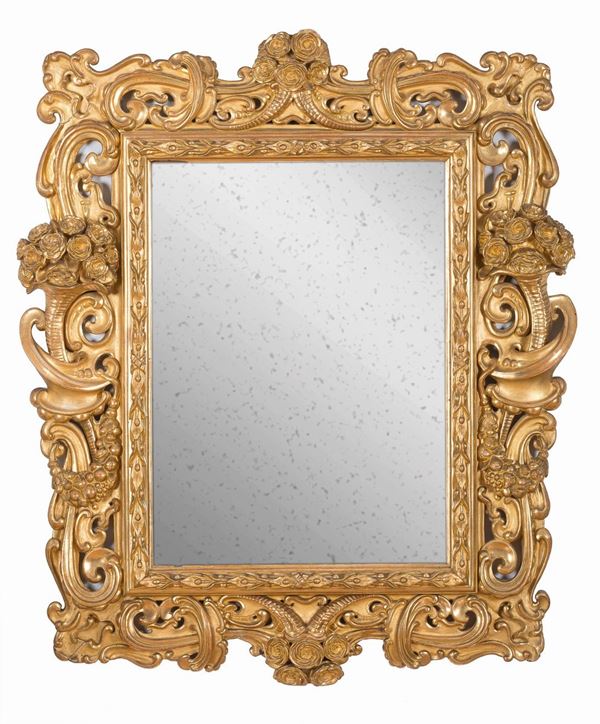 SPECCHIERA IN LEGNO DORATO, ITALIA CENTRALE FINE XVII SECOLO