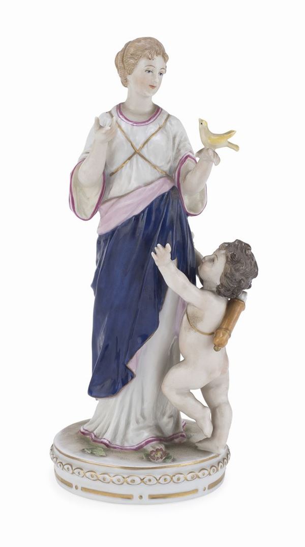 GRUPPO IN PORCELLANA DONNA E CUPIDO