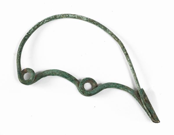 FIBULA AD ARCO IN BRONZO, VII-VI SECOLO A.C.