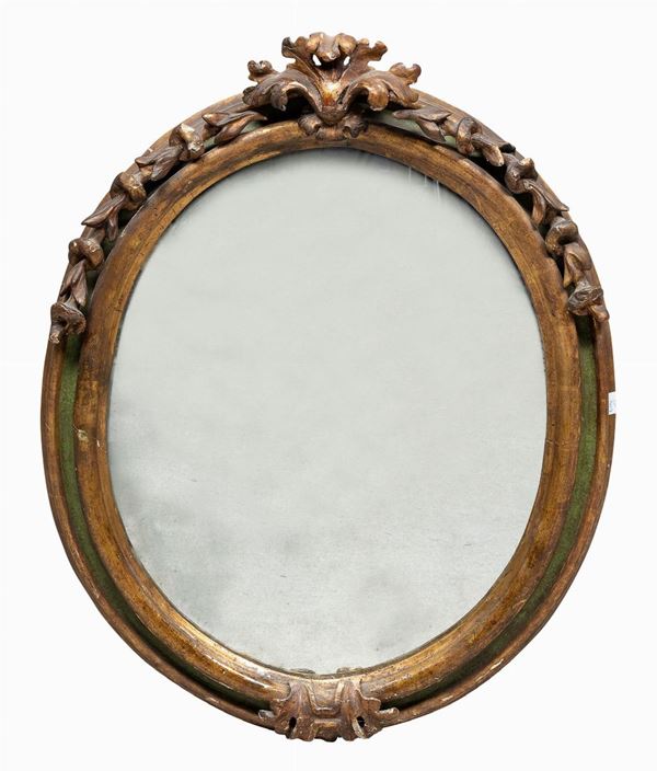 SPECCHIERA OVALE IN LEGNO DORATO, XVIII SECOLO