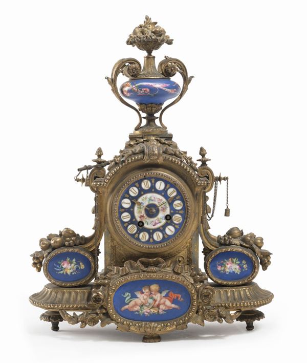 OROLOGIO IN BRONZO CON PORCELLANE