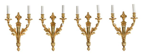 QUATTRO APPLIQUES IN BRONZO DORATO