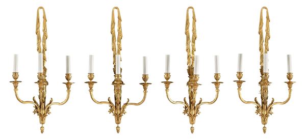 QUATTRO APPLIQUES IN BRONZO DORATO
