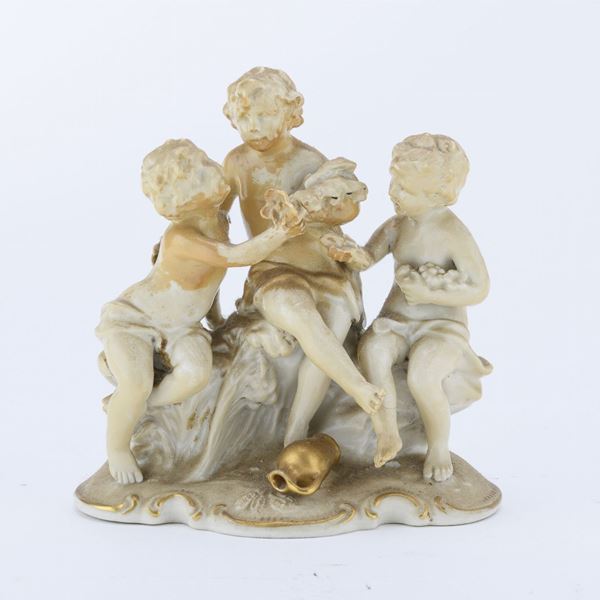 GRUPPO IN PORCELLANA PUTTI
