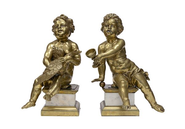 COPPIA DI PUTTI IN BRONZO DORATO, FINE XVIII, INIZI XIX SECOLO