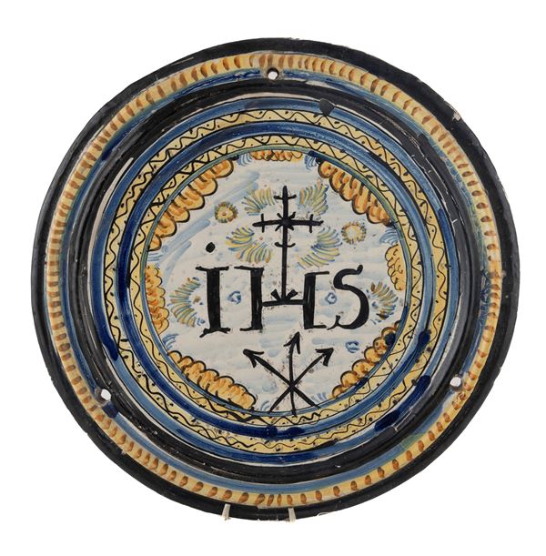 MATTONELLA CIRCOLARE IN MAIOLICA, FAENZA XVII SECOLO