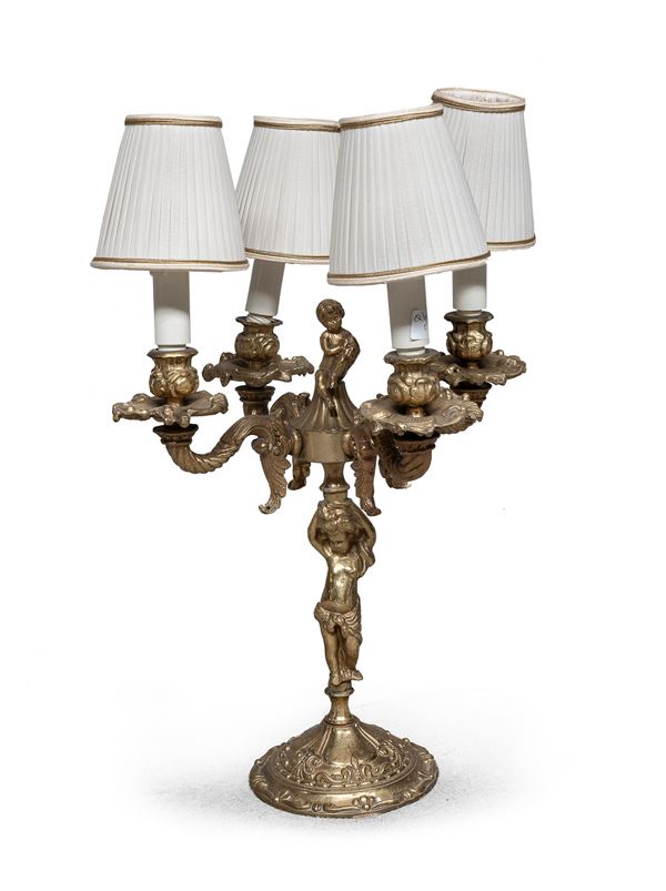 CANDELABRO IN METALLO DORATO, XX SECOLO